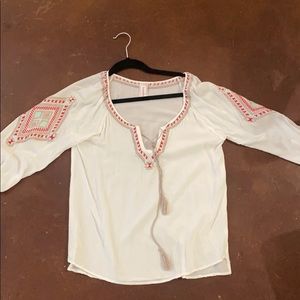 White flowy top with colorful detail on sleeves